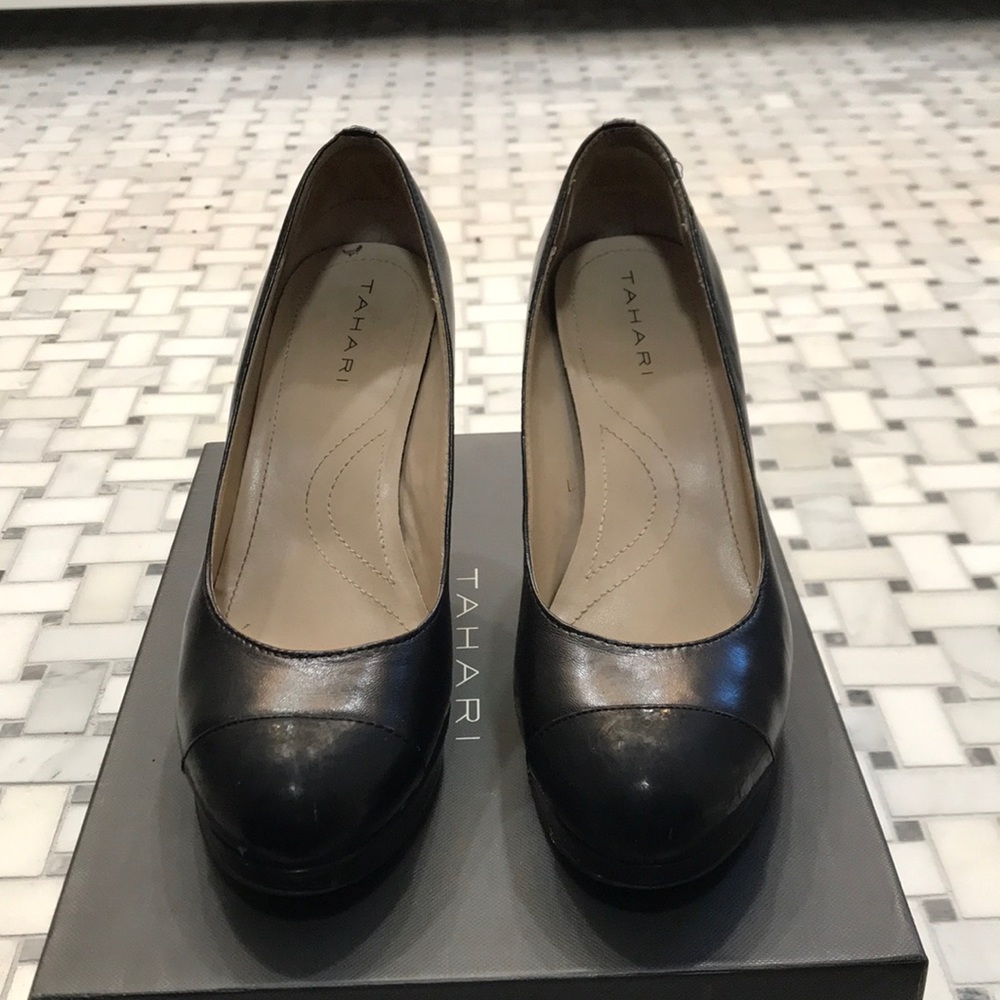 Black leather pumps